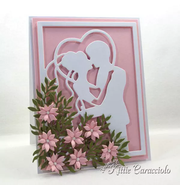 Create an elegant framed wedding card using die cut paper flowers.