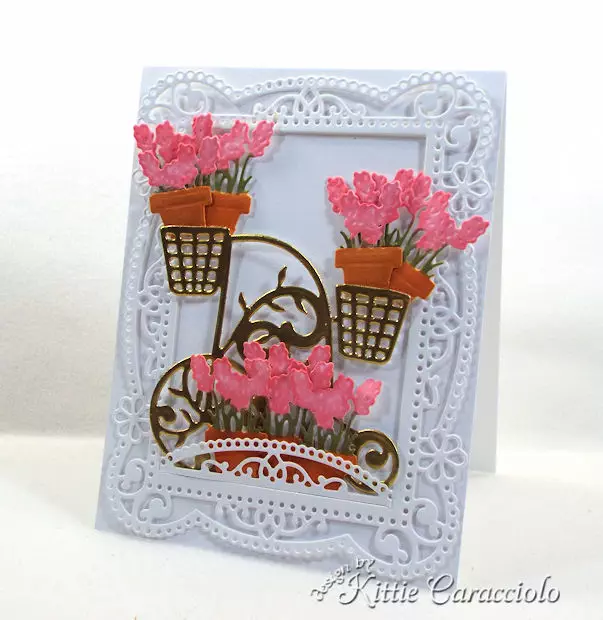 A gold embossed flower cart with a decortive frame makes such a pretty card front.