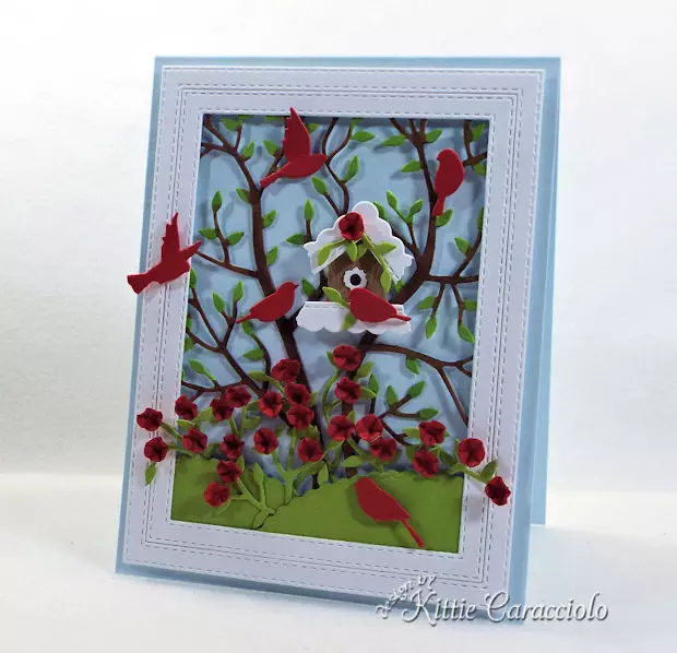 A birdhouse, birds and flowers make such a pretty card front scene.
