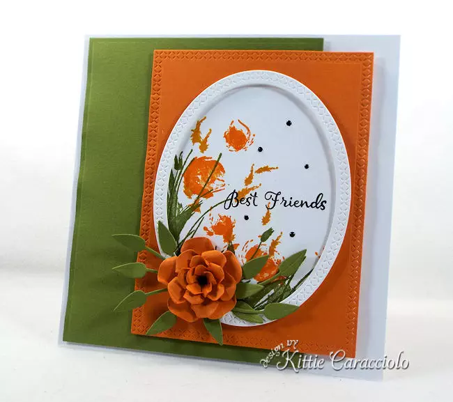 Die cut flowers and wildflowers creates a such an elegant card front.