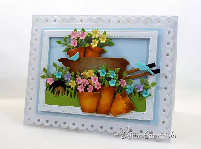 Come see how to make this die cut wheelbarrow and flower pots scene card perfect for anyone who loves gardening.