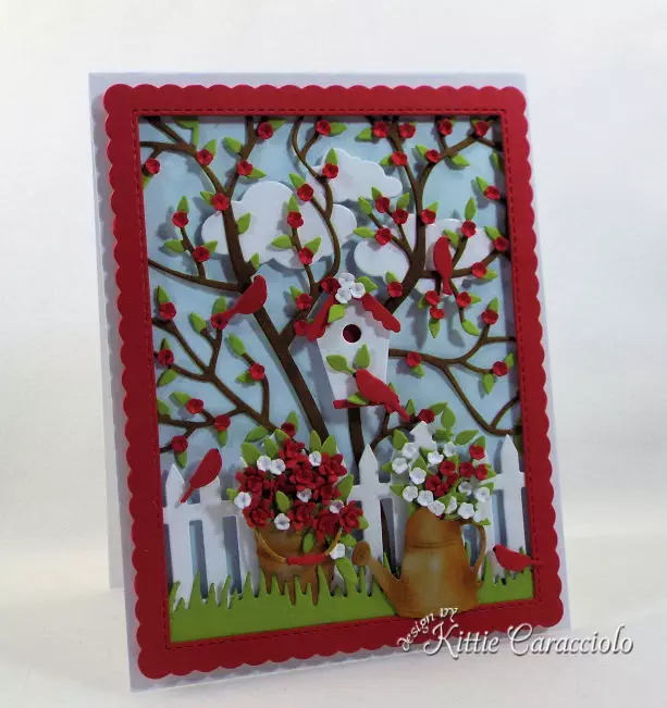 I love creating a die cut bird house scene card with garden images. and a tree and cloud background.