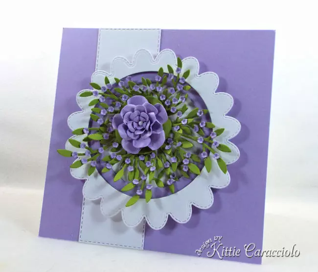 Come see how to make this die cut scalloped circle frame with flowers perfect for a flower lover.