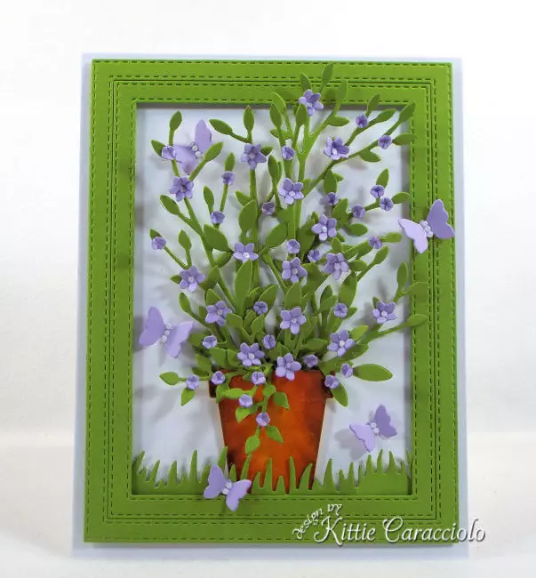 Come see this cheerful die cut framed potted plant and flowers that is perfect for any occasion