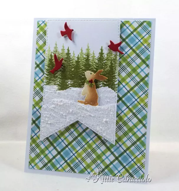 Come see how I made this chilly snowy die cut bunny scene using dies made by Rubbernecker Stamps.