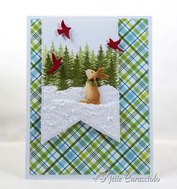 Come see how I made this fun snowy die cut bunny scene using dies made by Rubbernecker Stamps.