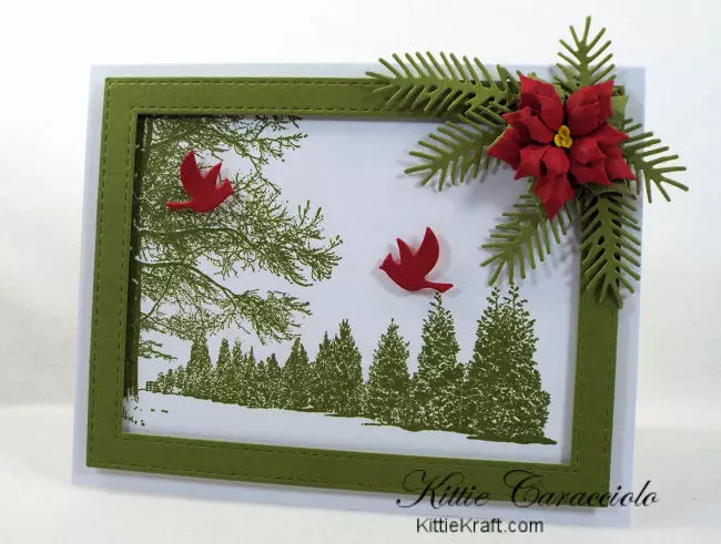 Come see how I made this snowy tree scene card embellished with a poinsettia and pine branches.