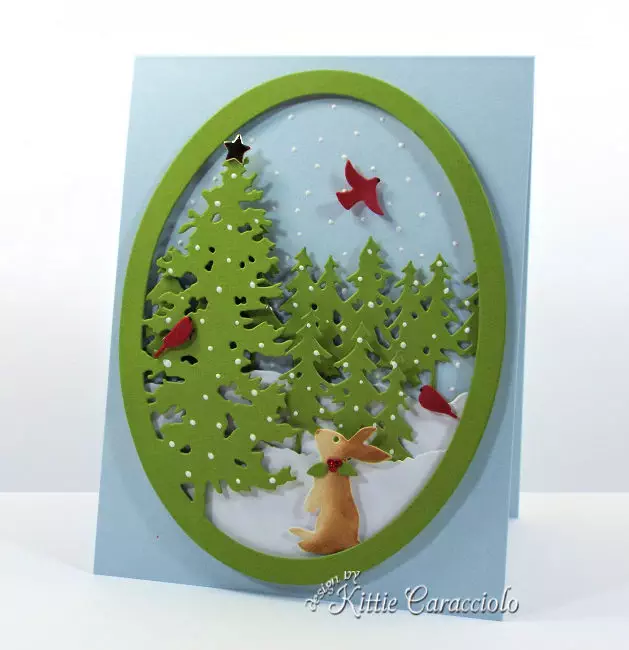 Come see how I made this die cut pine tree snow scene.