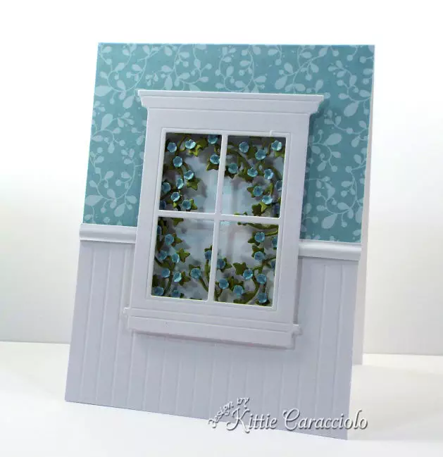 Come see how I made this elegant die cut window scene with ivy and flowers.