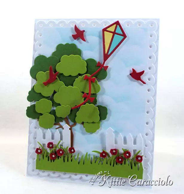 Come see how I made this die cut kite scene card.