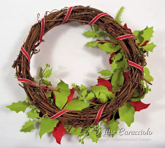 Click over to my blog to see how I made this paper poinsettia wreath.