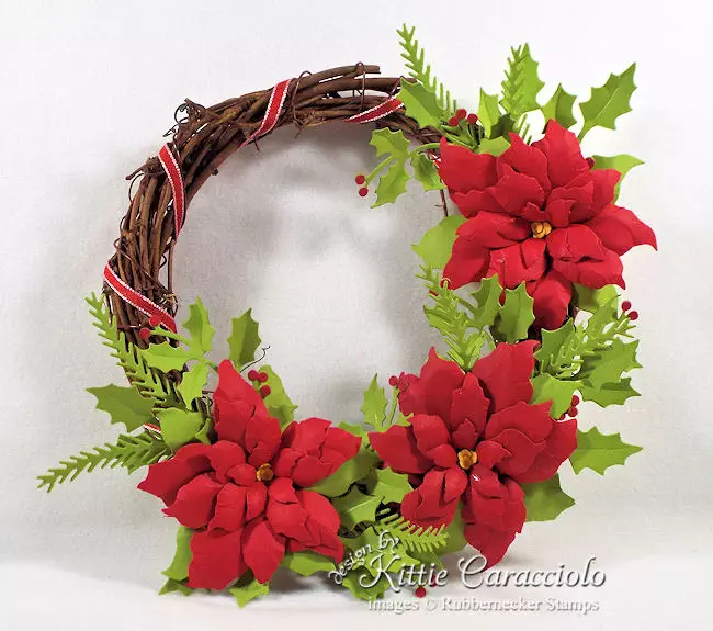 You can see all the details about how I made this paper poinsettia wreath on my blog.  Click through to see the details.