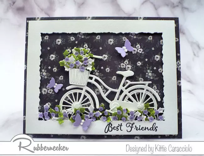 Click thru to check out how I made this white bicycle silhouette card with a pretty designer paper background and paper flowers.