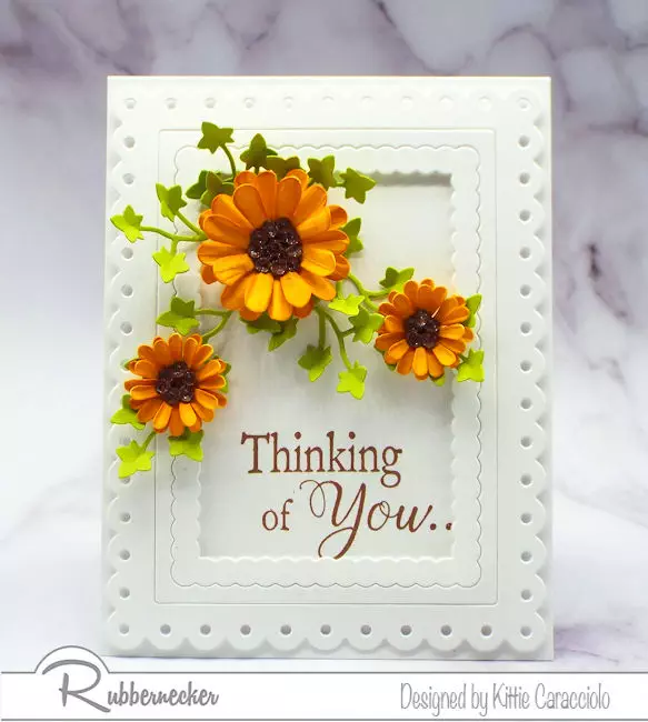I love adding dimensional paper flowers to my clean and simple cards.  Click through to see how I made my flowers.