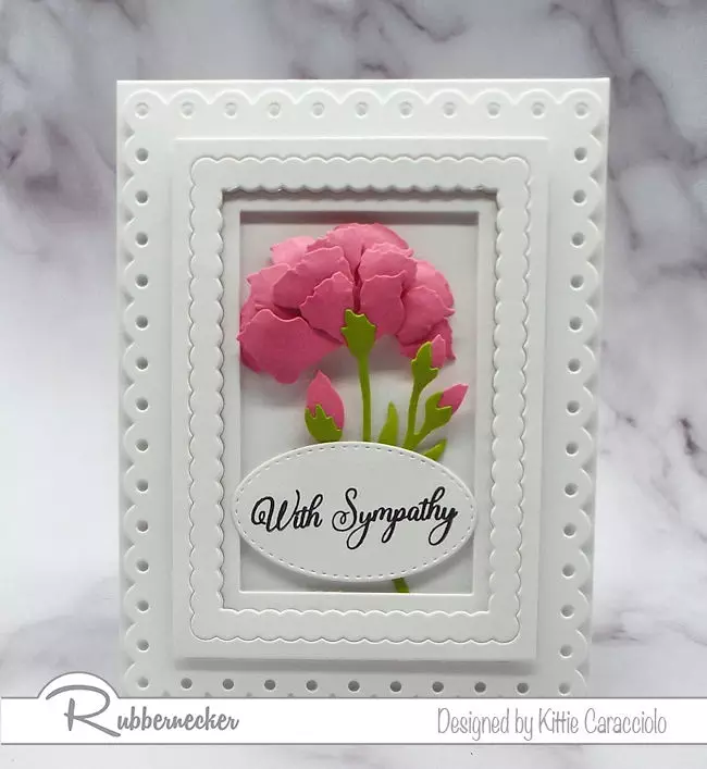 This handmade greeting card features an example of how to shape paper flowers using cardmaking die cuts