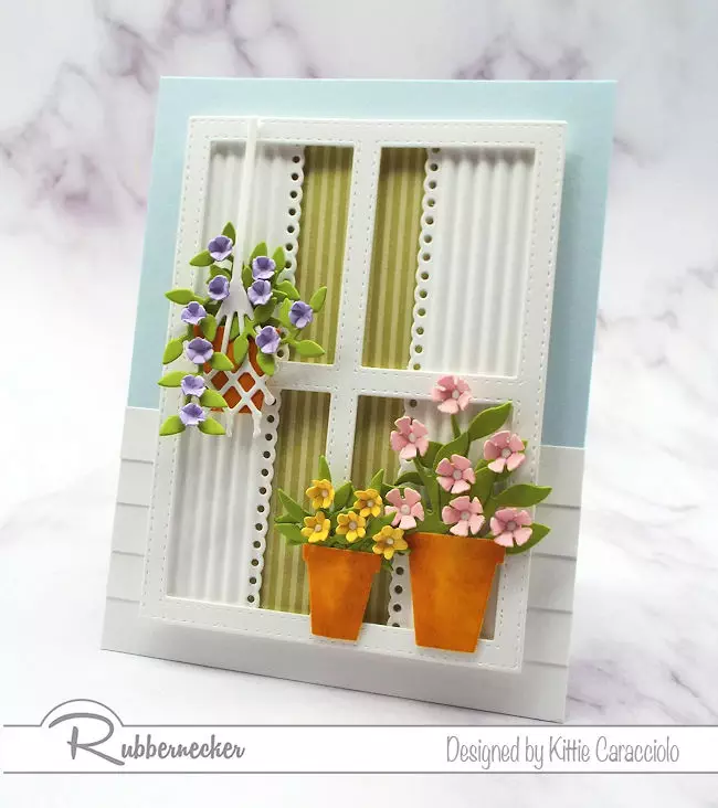 Using a window with flowers on a card front has become so popular. Come over to my blog to see how I made this scene using dies by Rubbernecker.