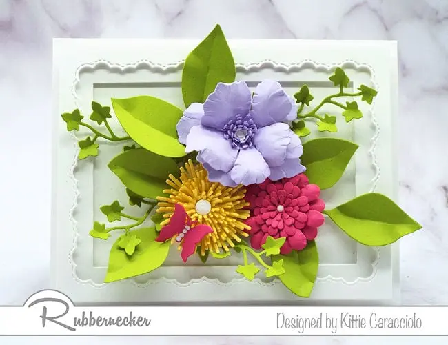 Click on the picture to see my super easy tutorial on how to shape paper flowers susing dies by Rubbernecker.
