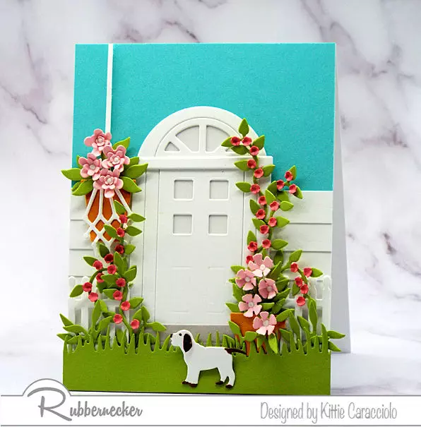 Door cards have become very popular in paper crafting.  Embellishing the door with flowers and foliage creates a pretty welcoming scene.