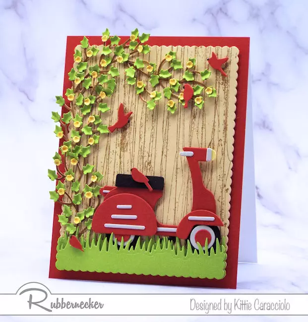 I had so much fun making this scooter card  with the wood fence background.  Come see how I made this using dies made by Rubbernecker.