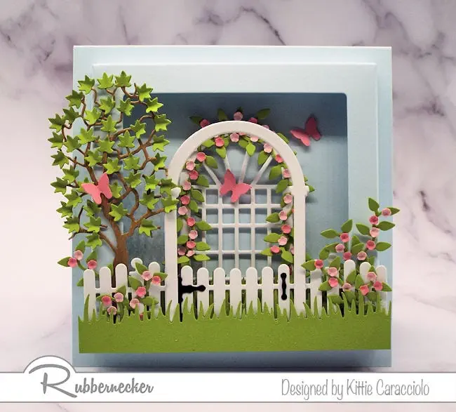 If you love to create cards with lots of dimension you will definitely want to check out this square shadow box frame by Rubbernecker.