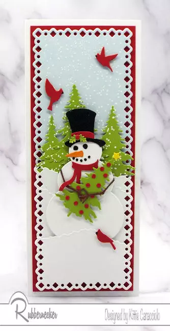slimline snowman Christmas cards with a die cut snowman holding a Christmas tree in a snowy scene