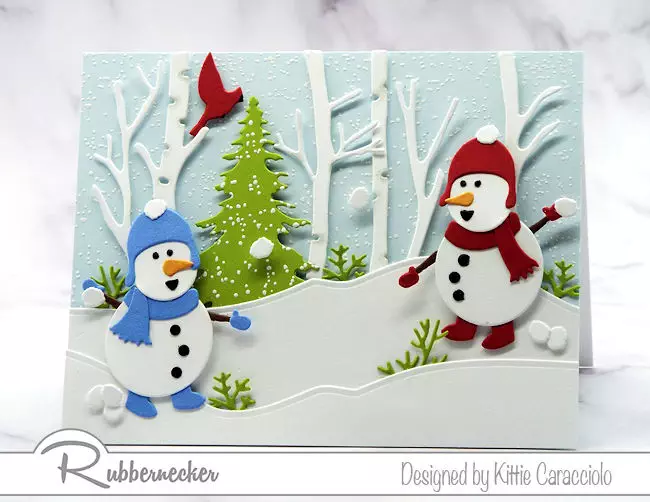 One of my snowman card ideas made using die cuts from Rubbernecker showing two tiny snowmen in their snowy forest