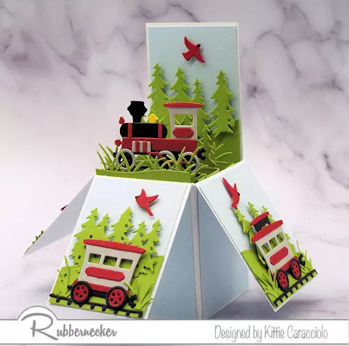 a train themed pop up explosion card with multiple vintage train elements all made from Rubbernecker card making dies