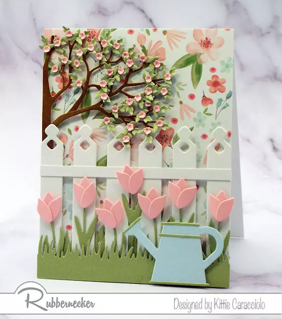 a card made with die cuts that are larger in the foreground and smaller die cut elements in the background for some easy perspective