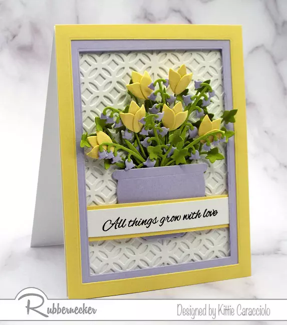 a pretty flower card idea using spring colors of yellow and lavender with die cut flowers from Rubbernecker