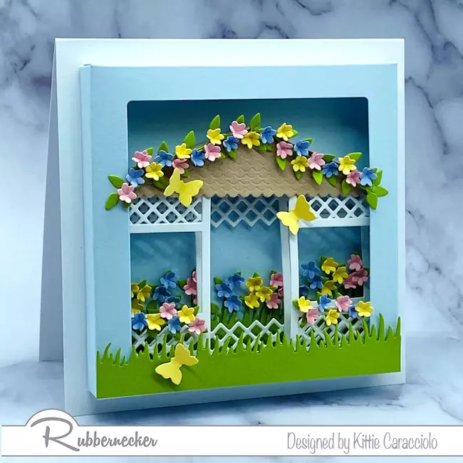 a floral gazebo card tucked into a shadow box frame all made using clever dies from Rubbernecker