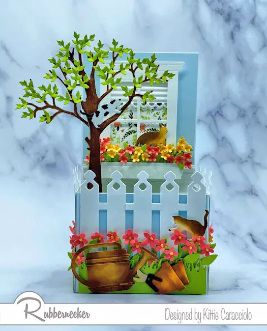 Learn how to modify a box fold pop-up card like this adorable scene made using dies from Rubbernecker