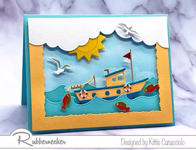 this handmade fishing boat card loaded with details and on the open sea was made using new dies from Kittie Kraft by Rubbernecker