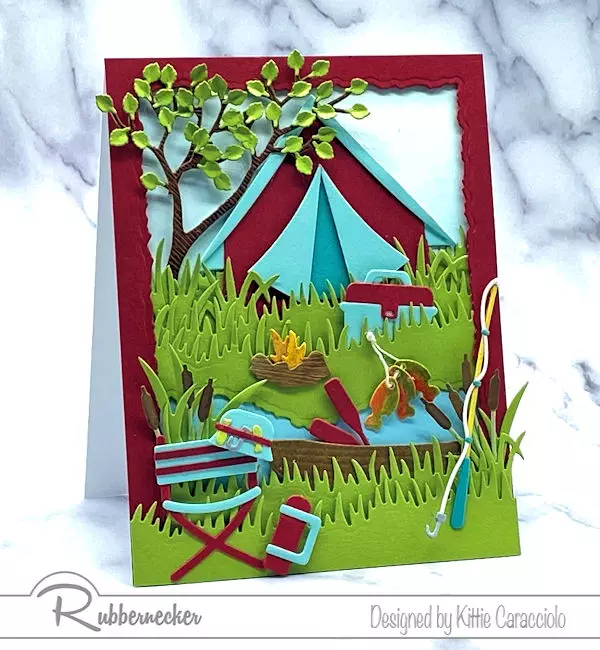 this DIY campground card with a tent, stream and everything to fish was made using card making dies from Rubbernecker