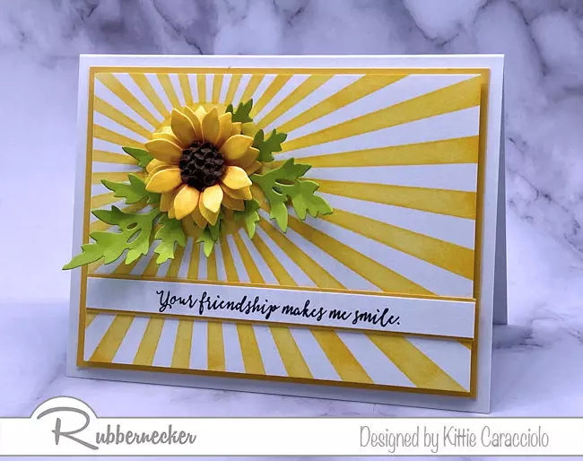 stencils and die cuts were used in combination to create this dramatic card with a beautiful paper sun flower made using products from Rubbernecker