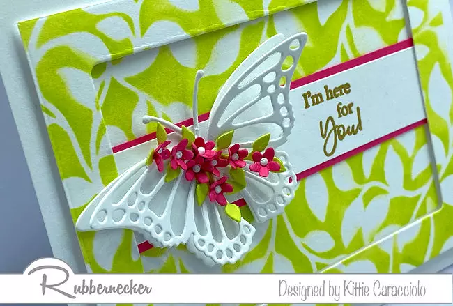 A close up detail of the die cut butterfly on a handmade greeting card created with stamps, dies and a leaf stencil all from Rubbernecker
