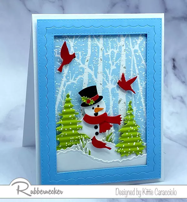 a new, two part birch tree stencil from Rubbernecker created the wintry background on this handmade card