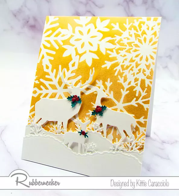 large snowflake stencils for cards plus an unexpected color in the background create a stunning handmade greeting card
