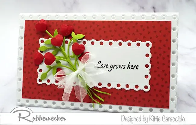 a pretty handmade card created using mini slimline card dies and tiny heart shaped paper flowers