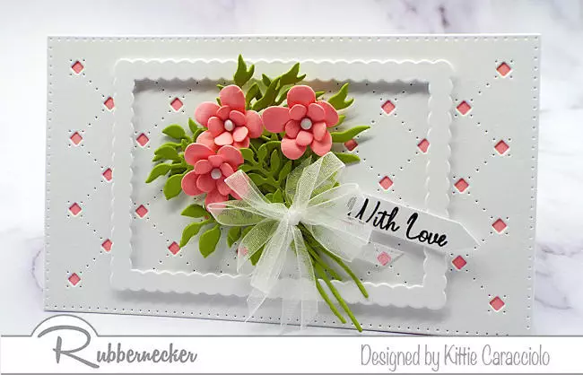 a mini slimline card with flowers arranged in a nosegay over layered die cuts