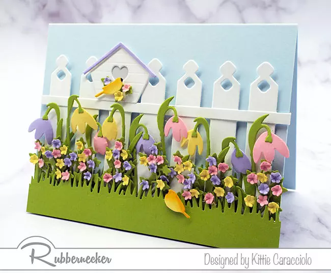 an example of bird house card ideas with lots of spring flowers and two tiny birds moving into their spring home