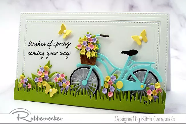 A pretty spring card with a retro bicycle used to show how to layer die cuts in card making for realistic perspective