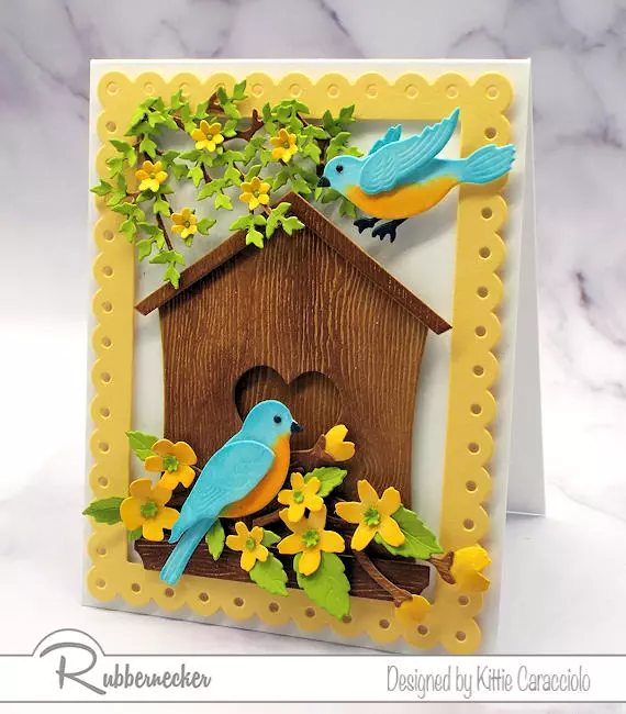 a die cut birdhouse with two die cut birds all made with new dies from Rubbernecker