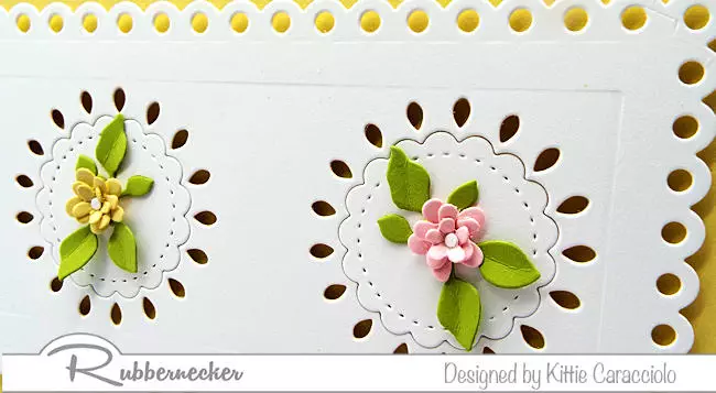 A detail image of the tiny paper flowers that adorn the project sharing this quick and easy die cut slimline floral card idea .