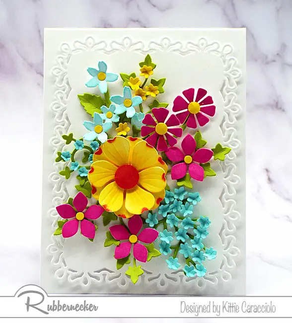 You can learn how to use flower cutting dies and inks to make bright, springy, beautifully realistic paper flowers like the arrangement on this handmade card.