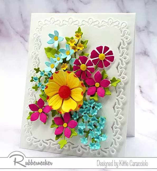 Learn how to use flower cutting dies to make brightly colored assorted types of paper flowers as shown on this handmade greeting card.