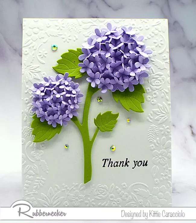 A purple version of handmade hydrangea flower cards easily made by placing multiple purple die cut flowers en masse to form these two beautiful blooms.