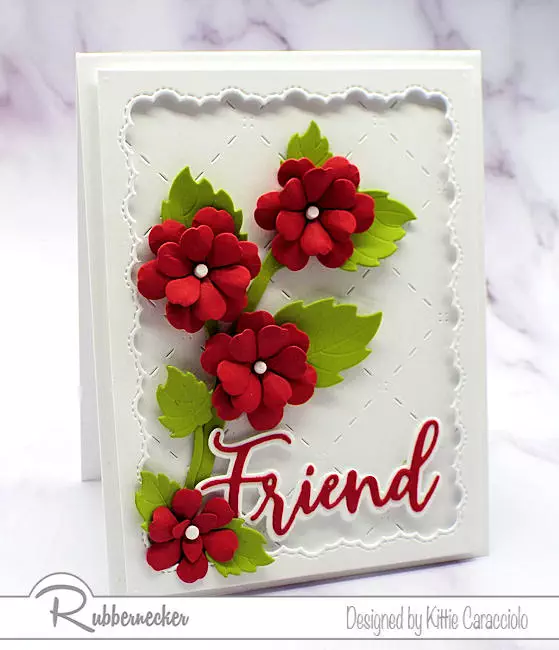 A handmade all occasion friend card idea with bold pops of red blossoms over a textural white layered background.