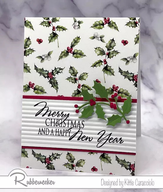 One of my super easy handmade Christmas cards with a gorgeous holly background and die cut holly details.