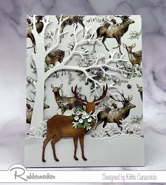 A beautiful patterned paper and easy to use dies make this example of gorgeous handmade winter cards with deer.