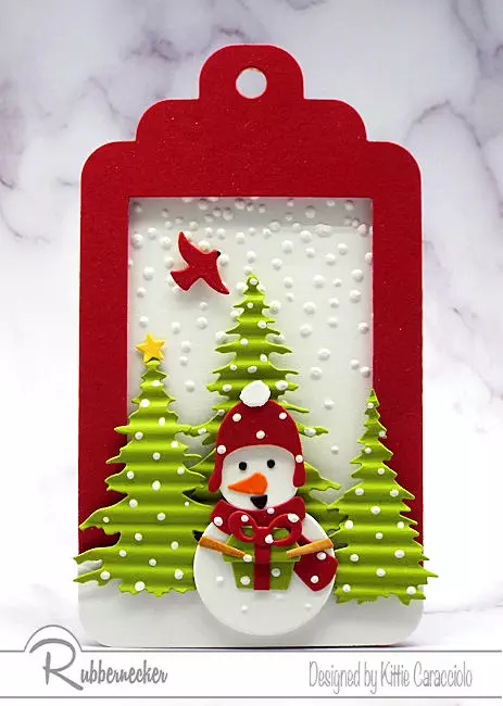 Learn several ways to use handmade holiday tags like this cute little snowman scene made with die cuts.